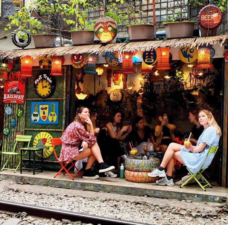 Tourists waiting for the train to come by 