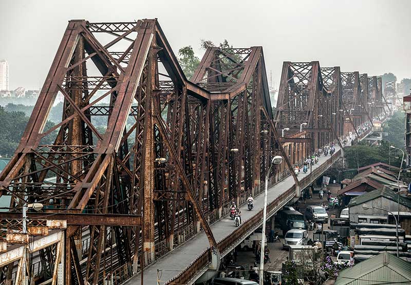 The old Paul Doumer bridge, renamed the Long Bien bridge, crosses the Red River for more than a kilometer and a half