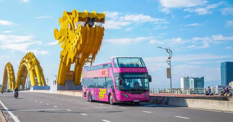 The famous Dragon Bridge in Da Nang with a sightseeing bus passing over