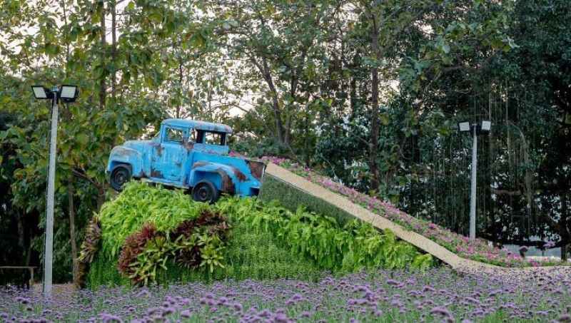 Car in a flower-filled garden