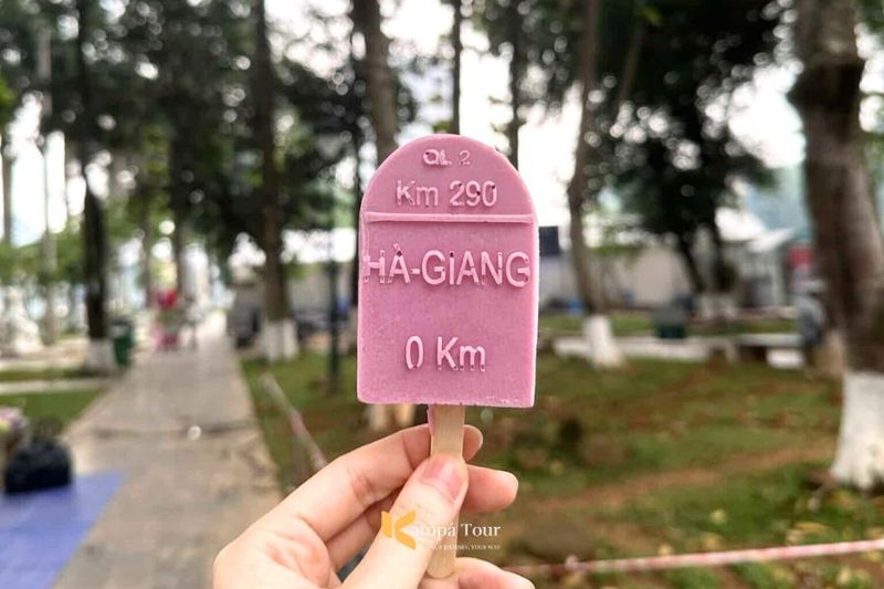 0 km milestone ice cream in Ha Giang Loop Vietnam shaped like a road marker