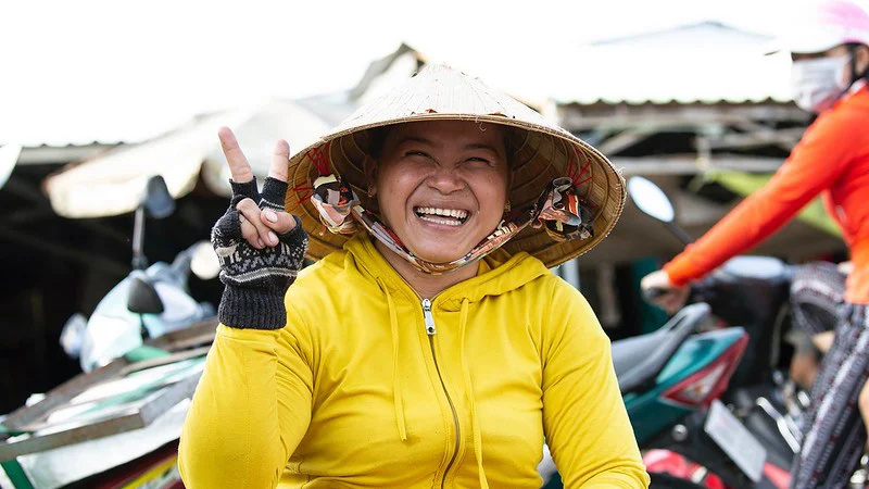 A saleswoman in the Mekong Delta greets her customers