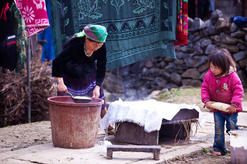 Children helping their parents with household chores as the New Year approaches