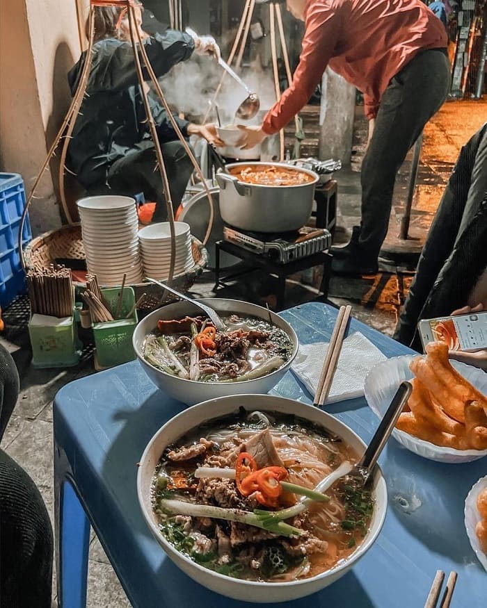 A Pho stall on the sidewalk in the old quarter of Hanoi