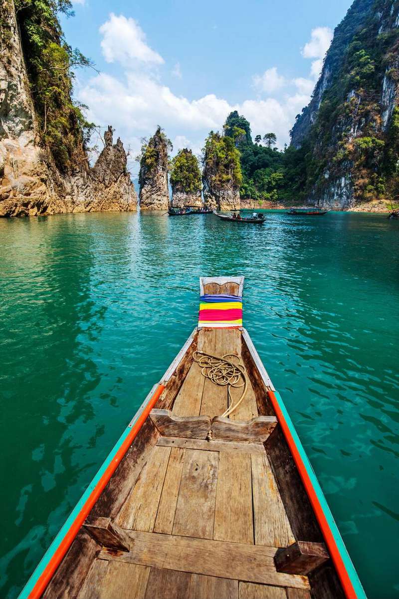 Traditional Thai wooden boat on Cheow Lan Lake.