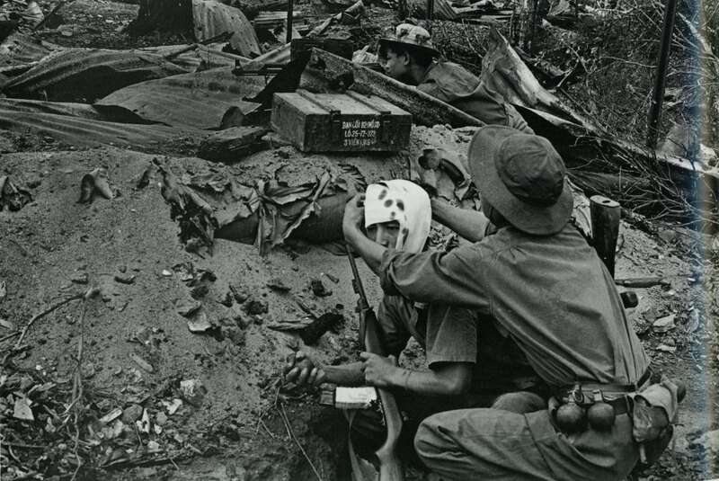 North Vietnamese soldiers are bandaging their comrades.