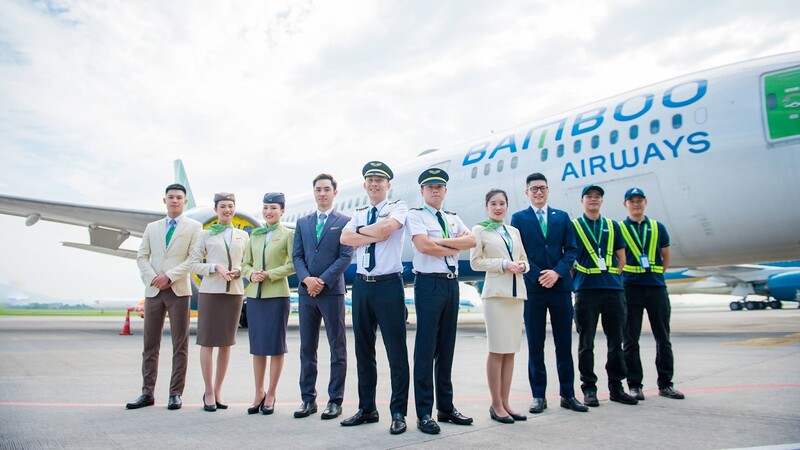  Bamboo Airways known for its modern fleet and distinctive branding, featuring white aircraft adorned with green and blue stripes and a stylized bamboo shoot logo on the tail. 