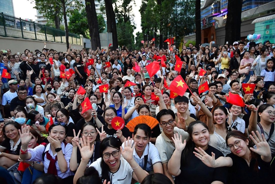Locals applaud the military parade