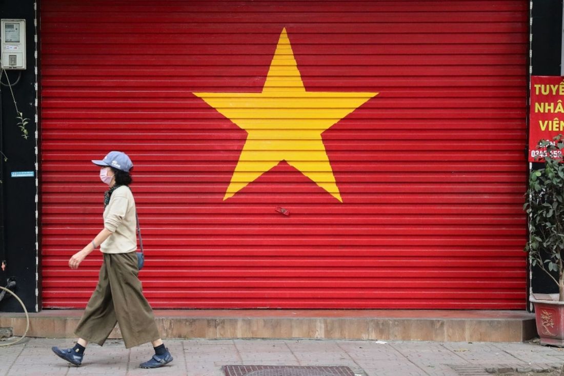 A shop door in Hanoi decorated with the national flag