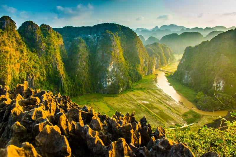 Majestic views of Ninh Binhs limestone peaks and vibrant rice fields
